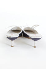 Back of Vintage Miu Miu kitten heels with navy and white color blocking, pointed toe, lace-up front with white laces, made in Italy