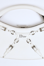 Close up of buckle clip front detail on Christian Dior White Bondage Patent Leather Mini Bag with Silver Hardware 