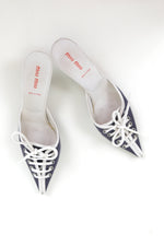 Vintage Miu Miu kitten heels with navy and white color blocking, pointed toe, lace-up front with white laces, made in Italy