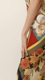 Video close-up of the level of detail on this vintage Salvatore Ferragamo silk scarf print halter neck dress.